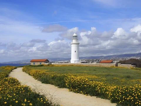 The old lighthouse in paphos cyprus surrounded by historic buildings with spring Fotos de archivo