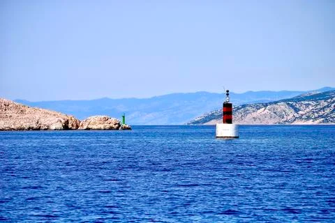 Old lighthouse on the rocks Stock Photos