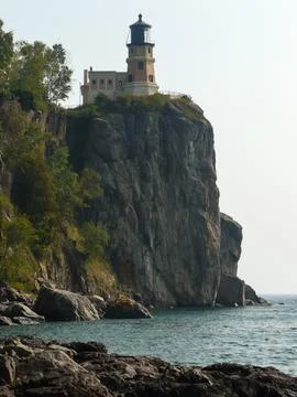 Old lighthouse on the rocks Stock Photos