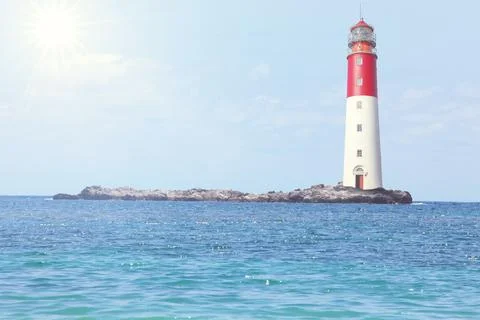Old lighthouse searchlight beam through marine air. Stock Photos