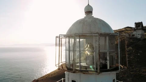 Old lighthouse on the seaside. Navigation equipment on the sea.  Stock Footage 162977069