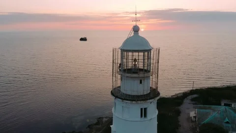 Old lighthouse on the seaside. Navigation equipment on the sea. Stock Footage 162977509