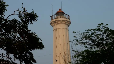 Old lighthouse at sunse. India coast. Stock Footage 323919189