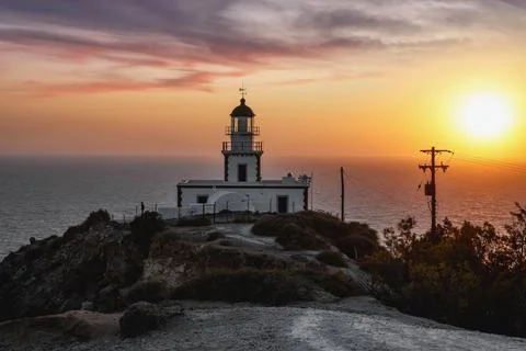 Old lighthouse at sunset. Stock Photos