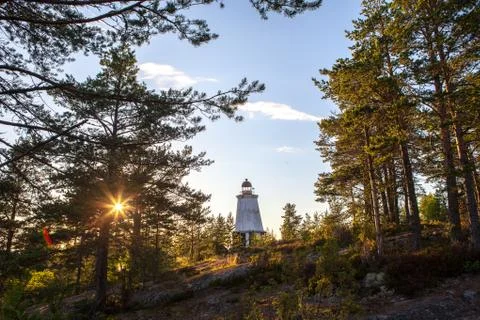 Old lighthouse in the woods Stock Photos