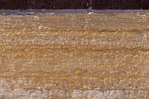 Old limestone block as part of a building foundation Stock Photos