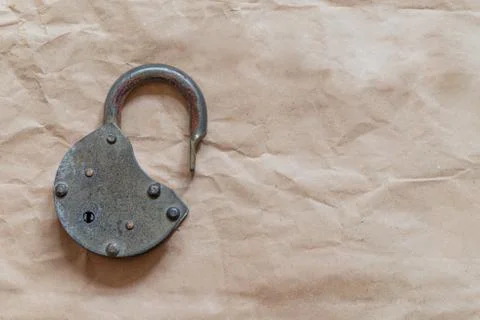 Old lock on old paper background Stock Photos