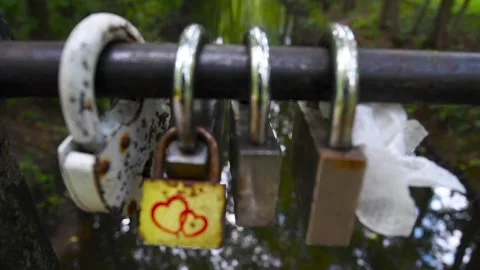 Old locks attached to the railing of the bridge Stock Footage 145453880