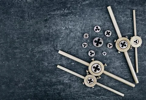 Old locksmith tools, dies holder and various dies for tapping external thread Stock Photos
