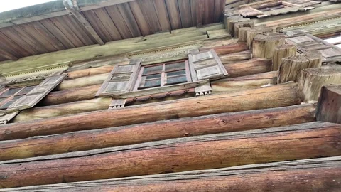 An old log cabin with decorations. Ancient wooden architecture. Stock Footage 315899747