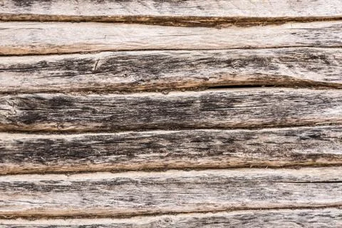 Old log wall, texture of antique wooden logs, close up decor abstraction back Stock Photos