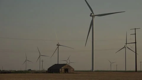 An old lonely cabin among wind turbines of Texas, 4K. Stock Footage 244491435