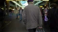 Old lonely man walking at food market with a bag, retirement, poverty. Slow-mo HD Footage