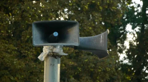 Old loudspeaker on a pillar against the background of trees 스톡 동영상 68209619