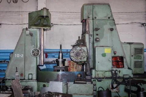 An old machine for manufacturing and processing metal parts Stock Photos