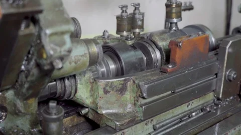 The old machine tool in the workshop, still continues to work and grind metal Stock Footage 117223118