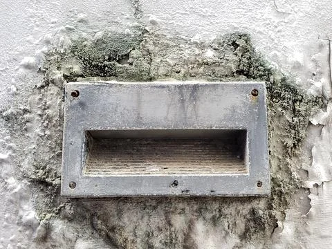 Old mailbox stuck to the wall Stock Photos