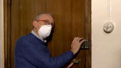 Old man alone in covid 19 quarantine needs help Stock Footage 127379570