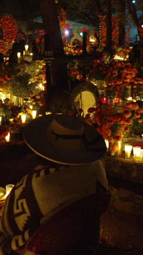 Old man and boy in vigil in Traditional Mexican altar  at Tzintzuntzan cemetery Stock Footage 342896931