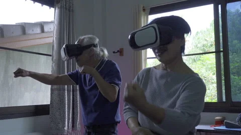 Old man and woman exercising boxing with VR slow motion Stock Footage 250792753