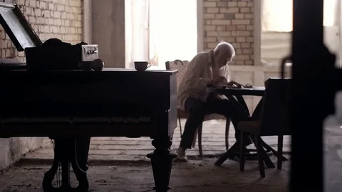 An old man of aristocratic appearance, but a bit disheveled, collects an old Video stock 100372945