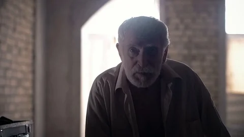 An old man of aristocratic appearance, but a bit disheveled, collects an old Video stock 100372956