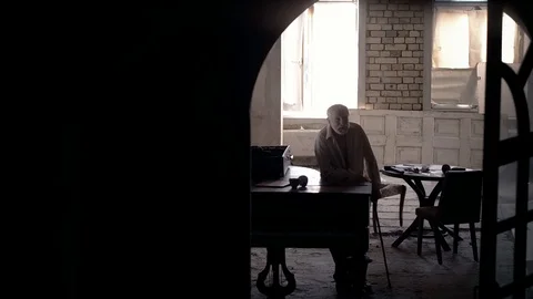 An old man of aristocratic appearance, but a bit disheveled, collects an old Video stock 100372967