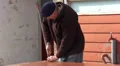 Old man assembling furniture HD Footage