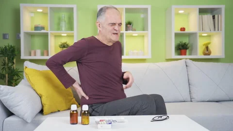 Old man with back pain. Stock Footage 235446661
