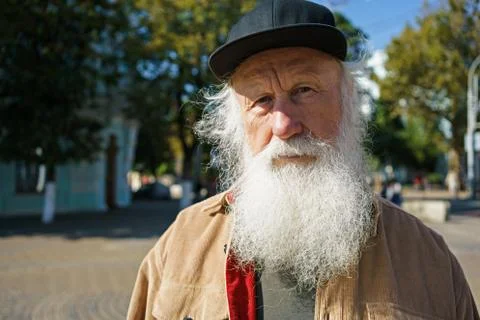 Old man with a beard on the street Stock Photos