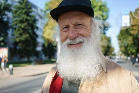 Old man with a beard on the street Stock Photos