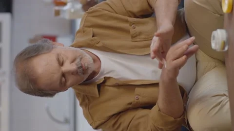 The old man with the beard who put cream on his hands is very happy. Stock Footage 151998576