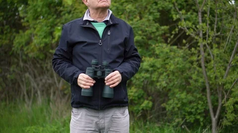 Old Man Birdwatching With Binoculars Stock Footage 113273731