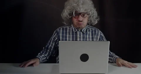 An old man boomer snorting while using computer Video stock 163316233