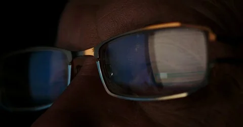 Old man browsing internet, reflection from glass Stock Footage 72633884