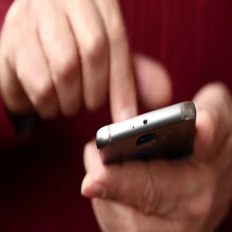 Old Man Browsing Online on Smartphone, Close Up Stock Footage 69411229
