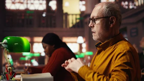 Old man in the campus library struggles with breathing and feeling unwell 스톡 동영상 313305158