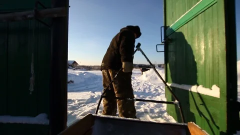 An old man carrying a trailer Stock Footage 87238807