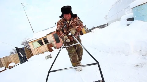 An old man carrying a trailer Stock Footage 87239763
