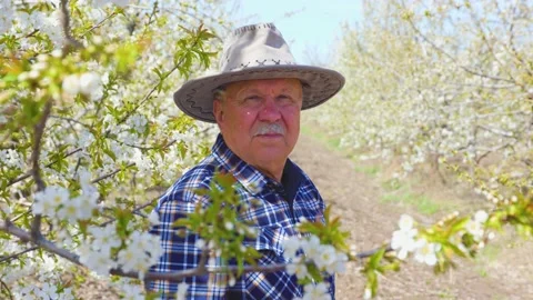 Old man charismatic farmer with hat looking at camera Stock Footage 182048405