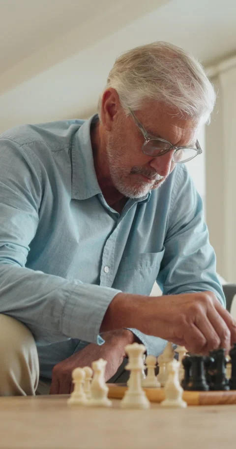 Old man, chess and game in home with strategy, solution or problem solving in Stock Footage 335865384