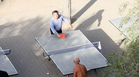 Old man of china play Table tennis in park Stock Footage 982507