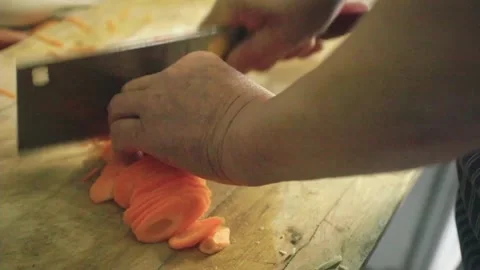 Old man chopping vegetables Stock Footage 235131977