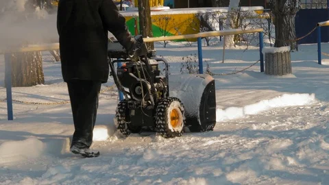 Old Man Clears Snow In City Park Stock Footage 101761157