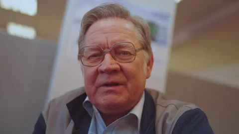 An old man communicates via video link Stock Footage 262416830