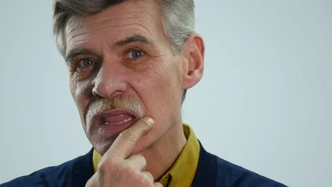 The old man corrects the mustache Stock Footage 86692354