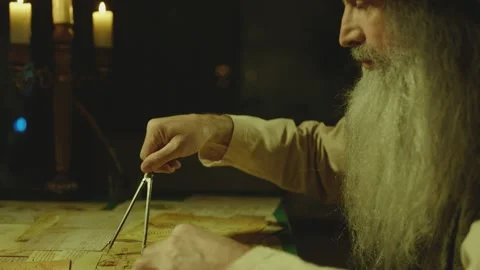 Old man counterpart of Leonardo Da Vinci working in dark room Stock Footage 195362564