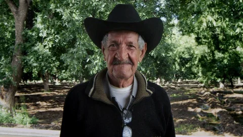 Old man in cowboy hat smiling Stock Footage 97652852