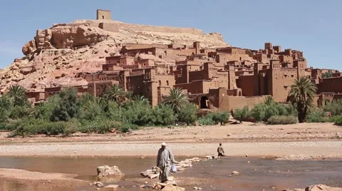 Old Man Crossing a River in Morocco Stock Footage 64315380