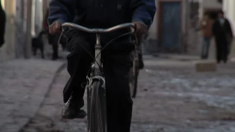 Old Man Cycling, An Active Elderly Man on a Bike in Tilcara, Jujuy, Argentina. Stock Footage 151172391